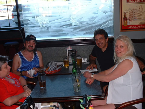 Three men enjoy an evening at the pub